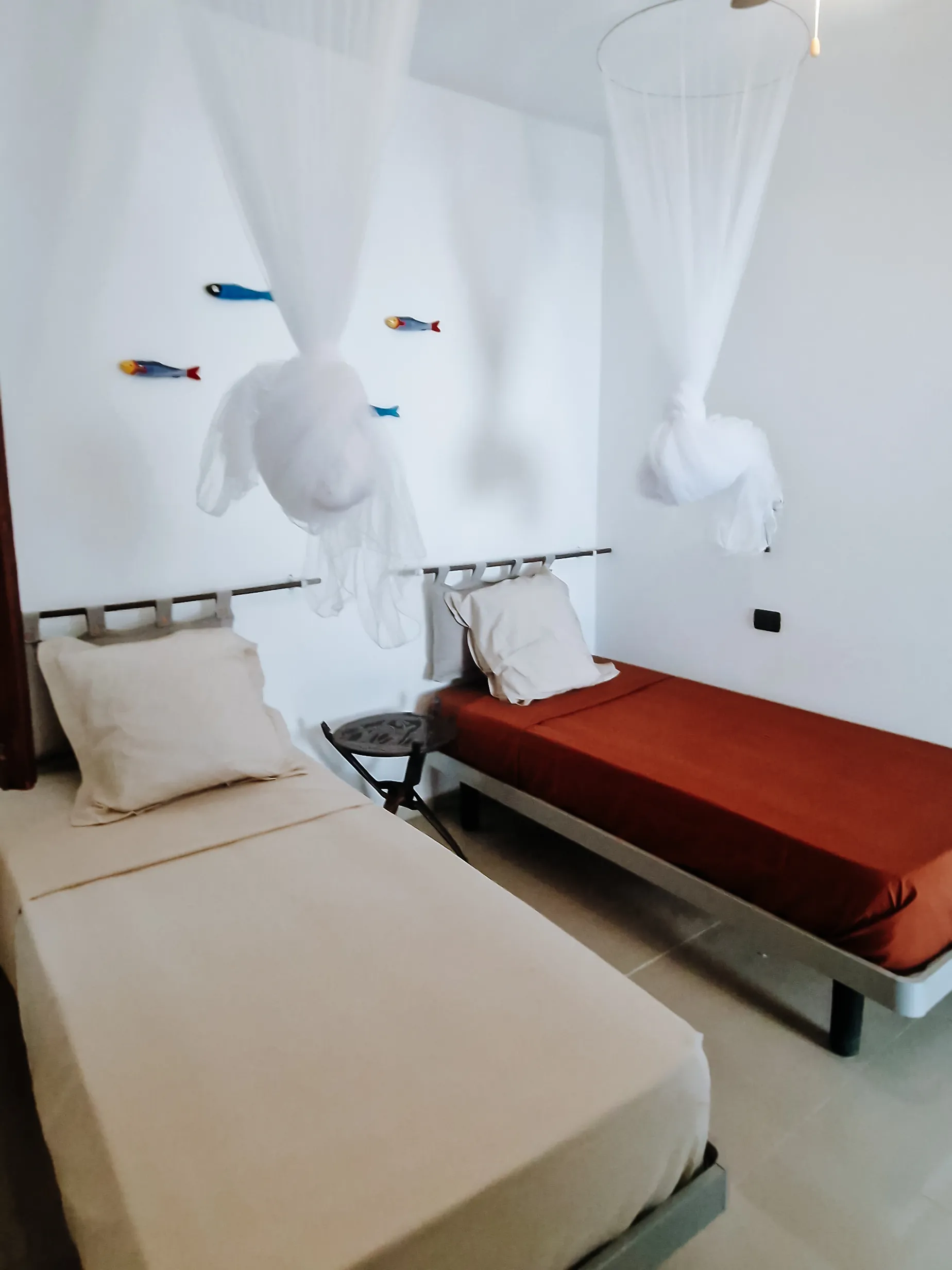 MAIO Twin Room: two single beds with mosquito nets